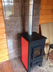 Купить стальной камин Везувий ПК-01 (270) в Могилеве фото в интерьере в Могилеве