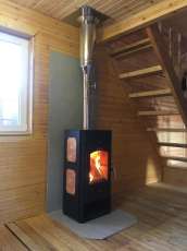 Популярный камин с дровницей Сибирь 8 в интерьере фото в Могилеве