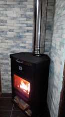 Стальной недорогой камин Теплодар ОВ-120 (угловой) фото в интерьере в Могилеве