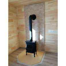 Чугунный камин со стеклом Сибирь 7 фото в интерьере в Могилеве