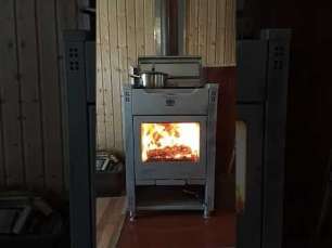 Стальной камин со стеклом Теплодар Кадриль фото в интерьере в Могилеве