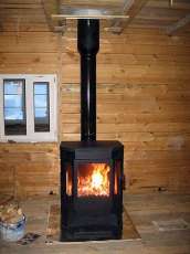 Печь-камин Бавария водяной с плитой в интерьере в Могилеве