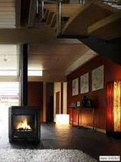 Печь-камин чугунный Invicta Carolo в интерьере Амазонка бай фото  в Могилеве