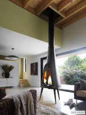 Печь-камин чугунный Invicta Pow-Wow в интерьере Амазонка бай фото в Могилеве