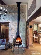 Печь-камин чугунный Invicta Pow-Wow в интерьере Амазонка бай фото в Могилеве